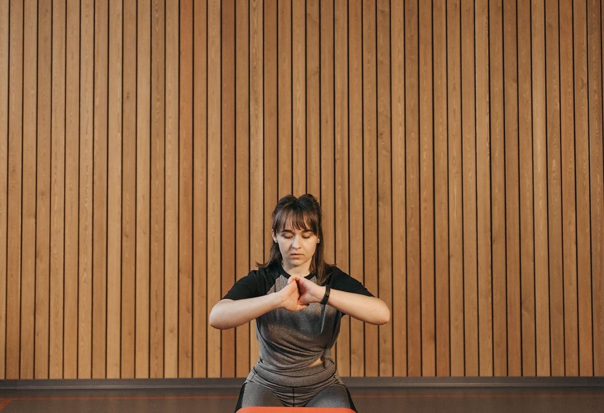 Resistance-band workout against a wood wall